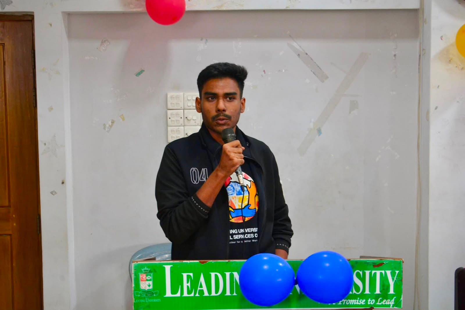 Badar Hossain, Co-Founder and Chief Operating Officer of Ravenence Limited — speaking at a Leading University Social Services Club event